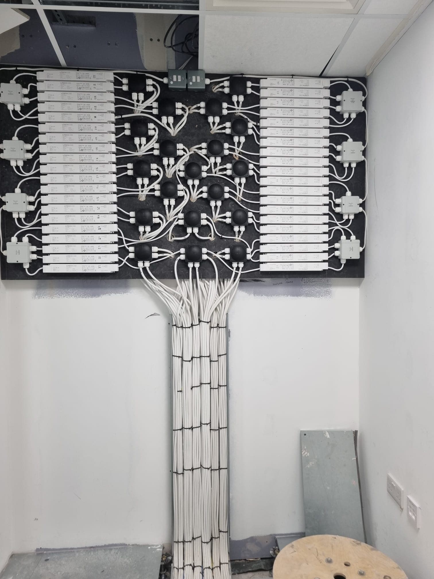 Vertical LED driver panel with organised white cabling
